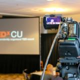 Video camera pointed at TEDxCU screen