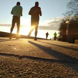 Stock image of people running in a park