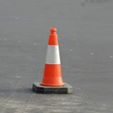 A traffic cone on pavement.