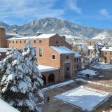 Snowy University Memorial Center with flatirons in background
