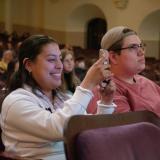 Audience members listen to a keynote speaker at the 2022 Conference on World Affairs