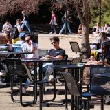 Students catch up on studying and relaxing at the UMC fountain area