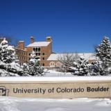 Snow-covered University of Colorado Boulder sign