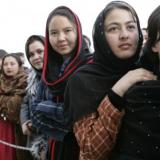 Women of Afghanistan stand outside the U.S. Embassy in Kabul, Wednesday, March 1, 2006. President George W. Bush and Laura Bush made a surprise visit to the city and presided over a ceremonial ribbon-cutting at the embassy. (Staff Sgt. Russell Lee Klika, US Army National Guard; Source: Wikimedia Commons)