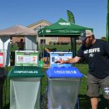 A person recycling a can at CU Boulder