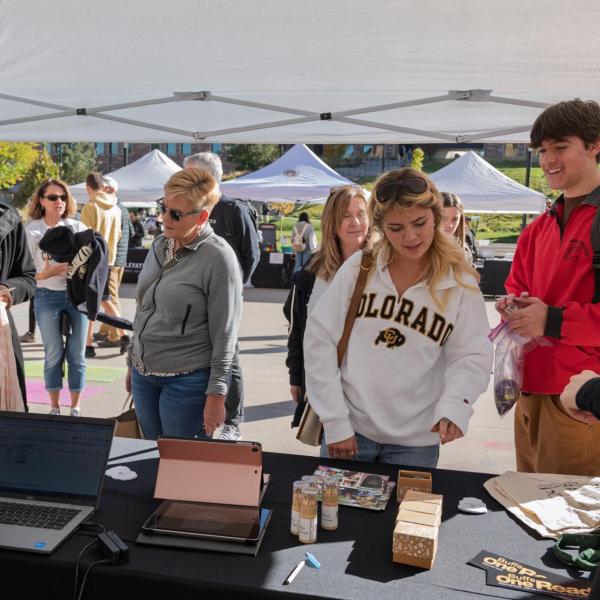 Campus community members visit a booth at the Take Care Fair