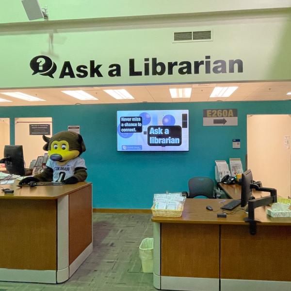 Chip the buffalo mascot at the Ask a Librarian desk
