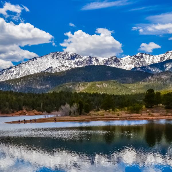 View of mountain reflected in a lake with sandy beaches