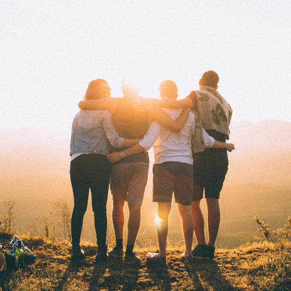 Group of friends arm in arm