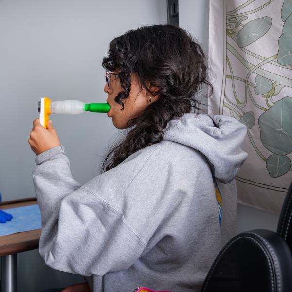 A demonstration of a breathalyzer test inside a van