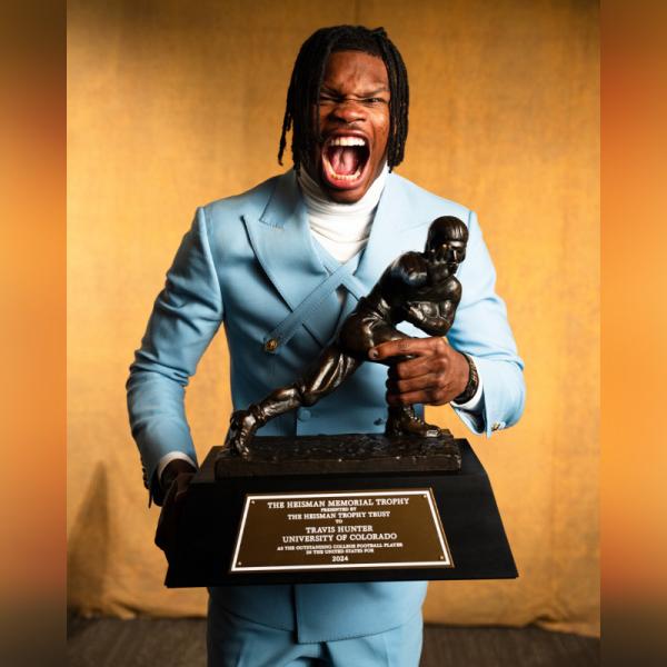 Travis Hunter with Heisman Trophy