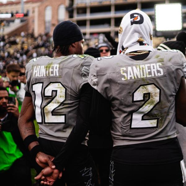 Buffs football players Hunter and Sanders post game.