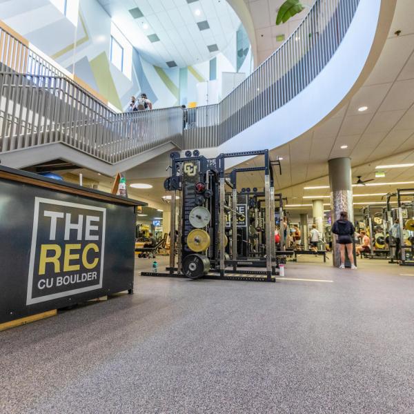 People working out on weight sets at The Rec