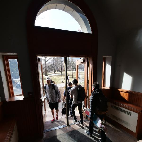 Students file through a doorway in the Hale Science building