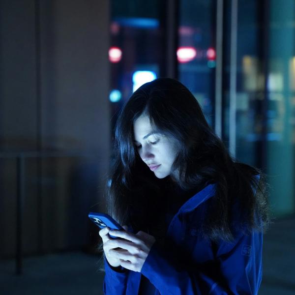 person stalking someone on their phone