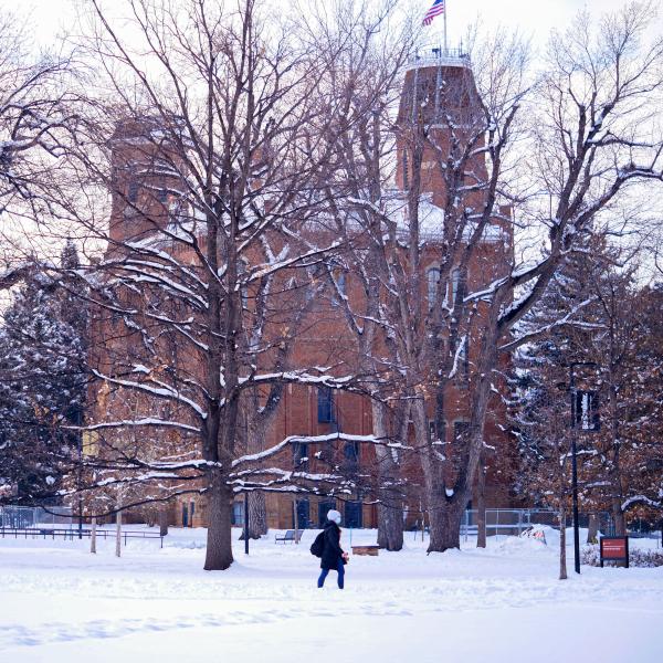 campus community member on a snowy campus