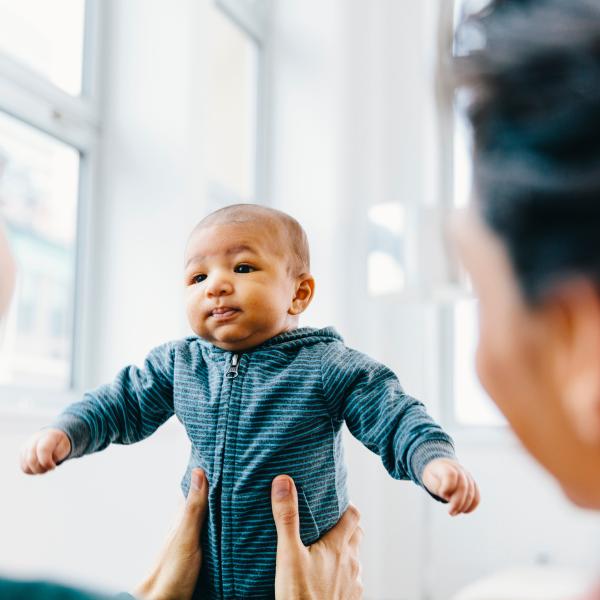 Baby being held.