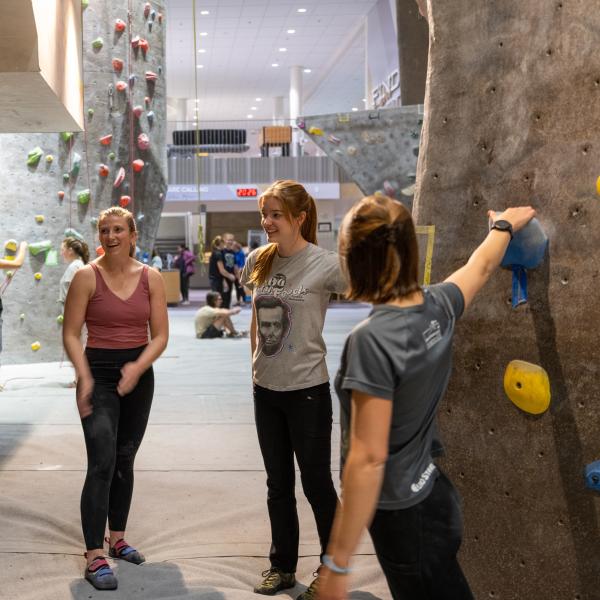 students participating in Women's Rock Night at the Rec climbing gym