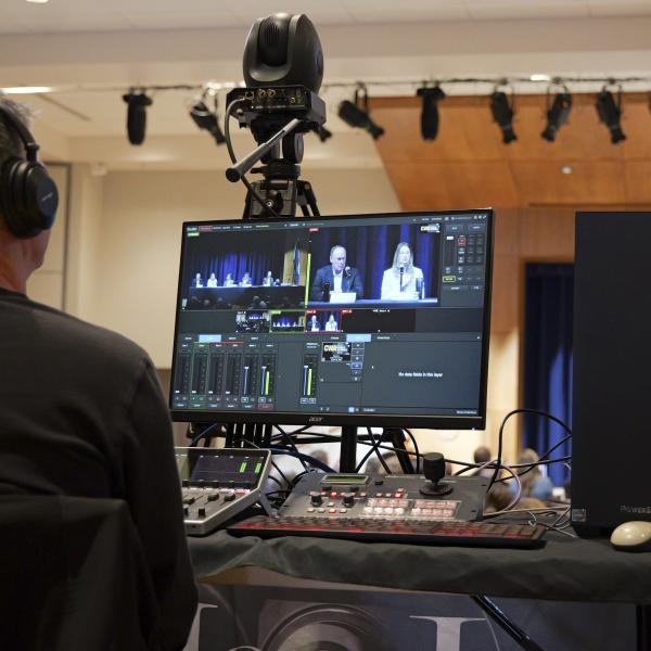 technician recording a livestream during the Conference on World Affairs