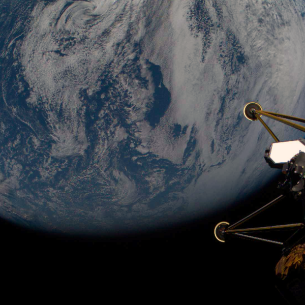 View of the Earth from space with the legs of a spacecraft in the foreground