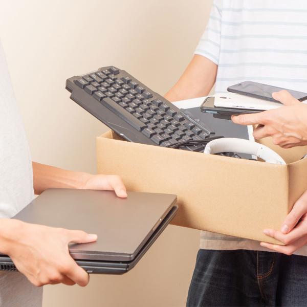 person turning in a used computer