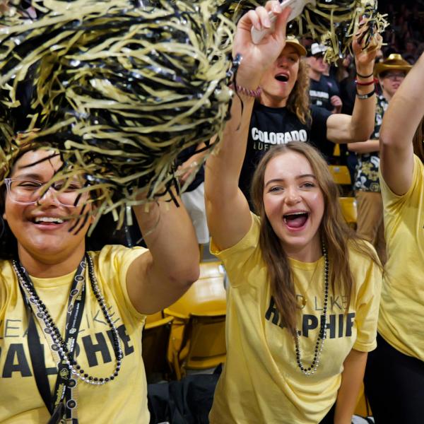 students in Buffs gear cheering