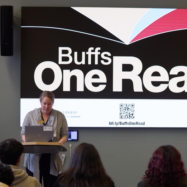 someone speaking at Buffs One Read event
