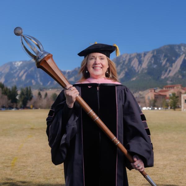 Leigh Holman in commencement regalia