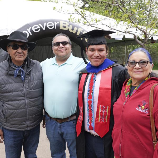 Student with family members at Native Graduation