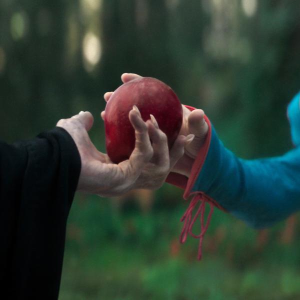 Snow White taking the poison apple in new Disney film