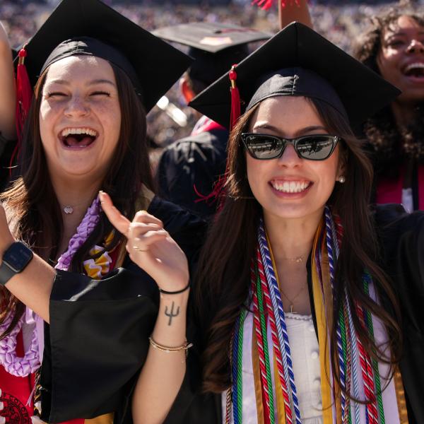 Graduates clap during the ceremony