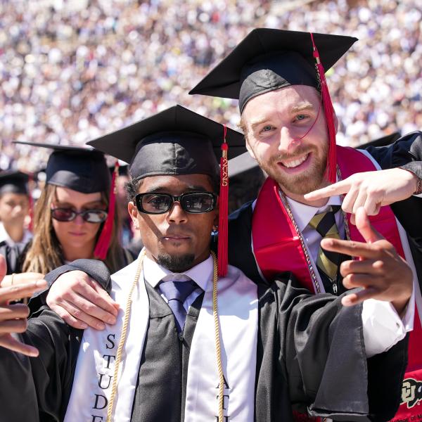 CMCI graduates pose for a photo on Folsom Field