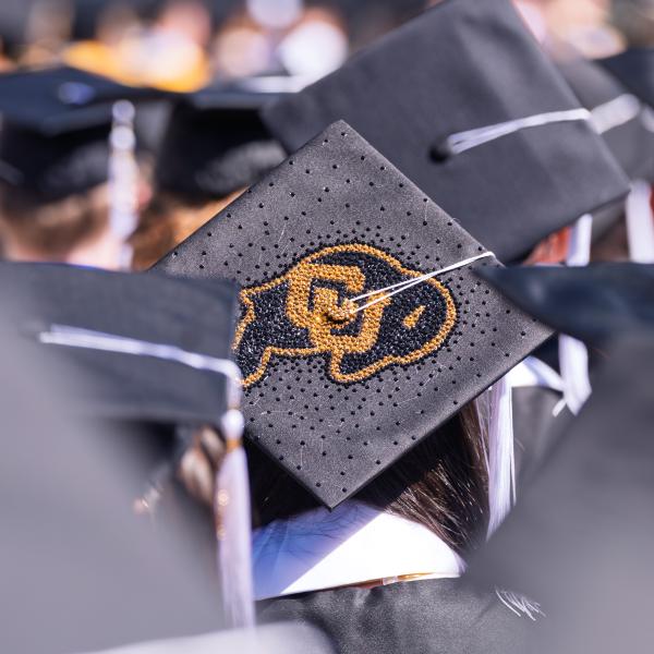CU Buff logo on a graduate's cap