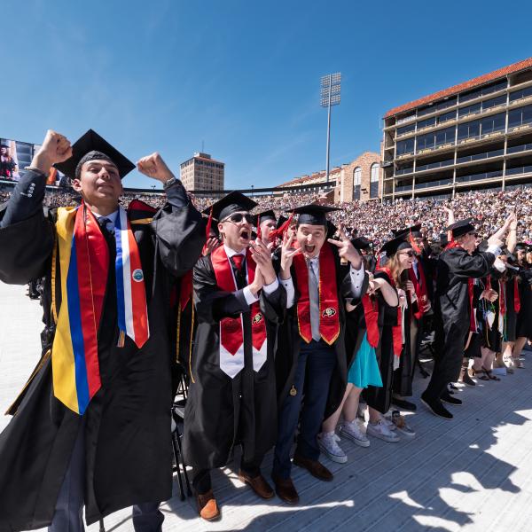 CMCI graduates cheer during the ceremony