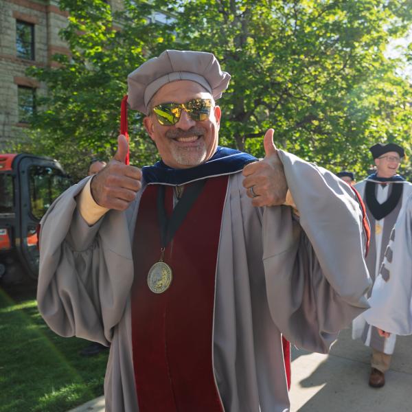 Chancellor Justin Schwartz on Norlin Quad before the procession onto Folsom Field