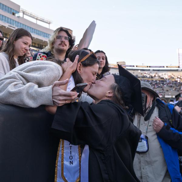 Families and graduates embrace in Folsom Stadium