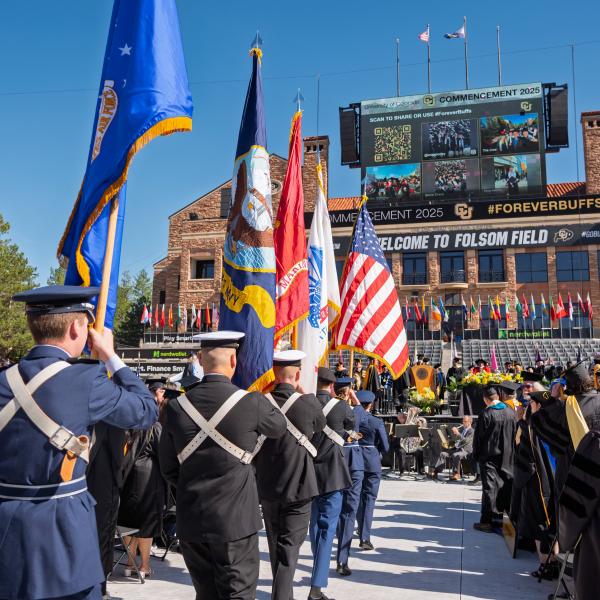 ROTC color guard processes onto Folsom Field