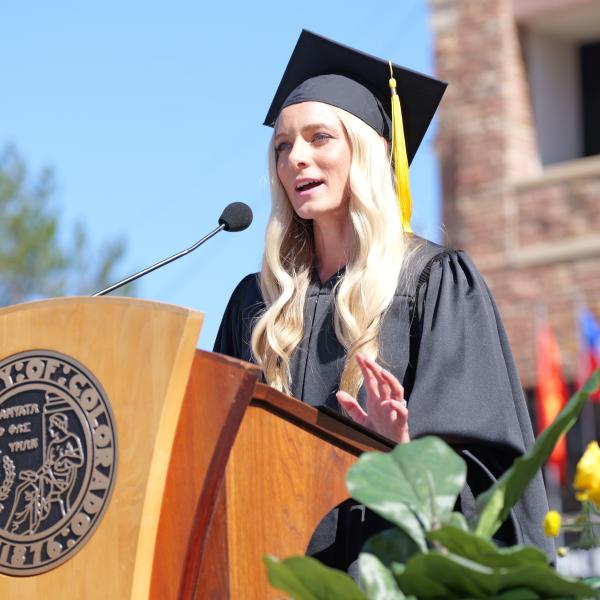Commencement speaker, alumna and Olympian Emma Coburn speaks at the podium