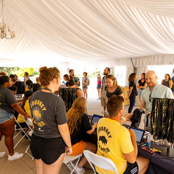 Campus community members volunteering at a Fall Welcome event