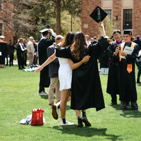 graduating students in regalia on Norlin Quad