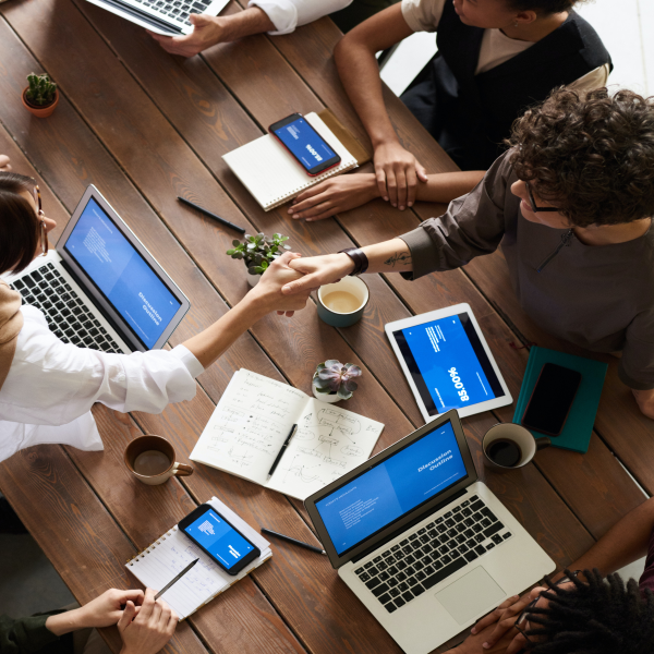 people shaking hands during a business meeting