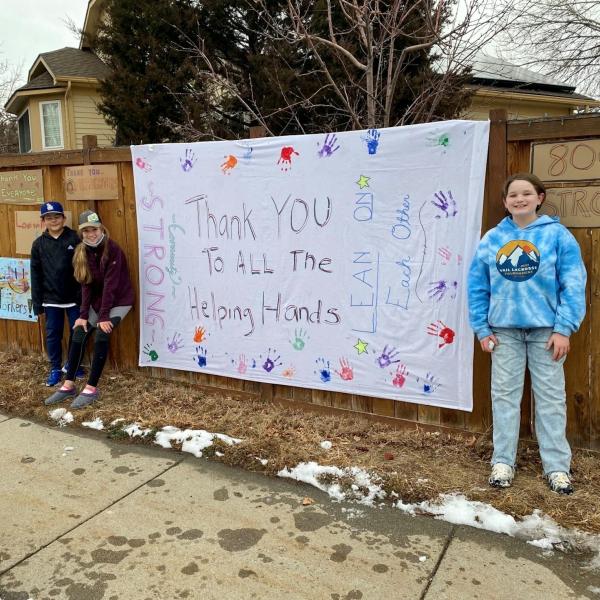 children who painted signs of community resilience and thanking first responders