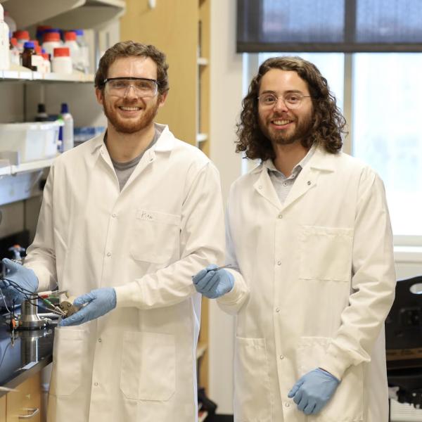 Anthony Straub with PhD student Kian Lopez in a lab