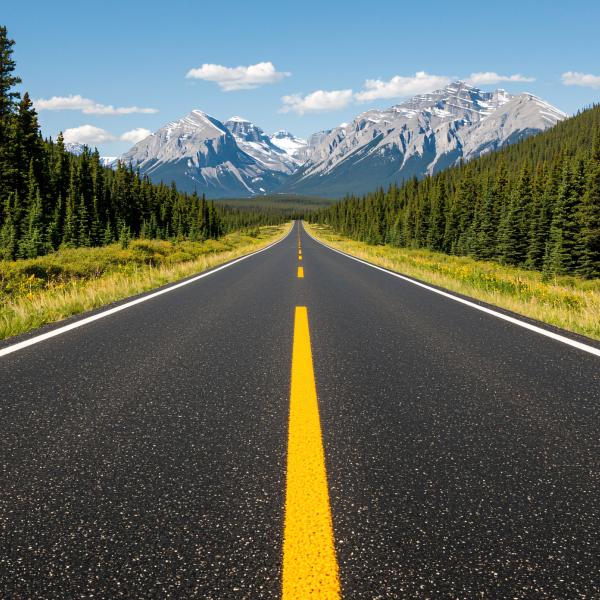 open road heading toward mountains