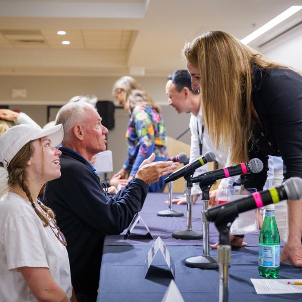 campus community members engage with panelists at the Conference on World Affairs