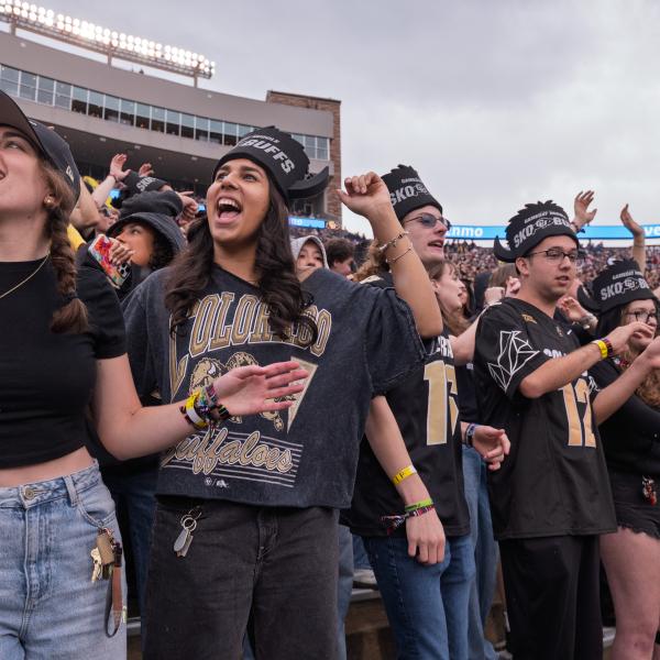 Buff fans cheer from the stands. (Photo by Glenn J. Asakawa/University of Colorado)