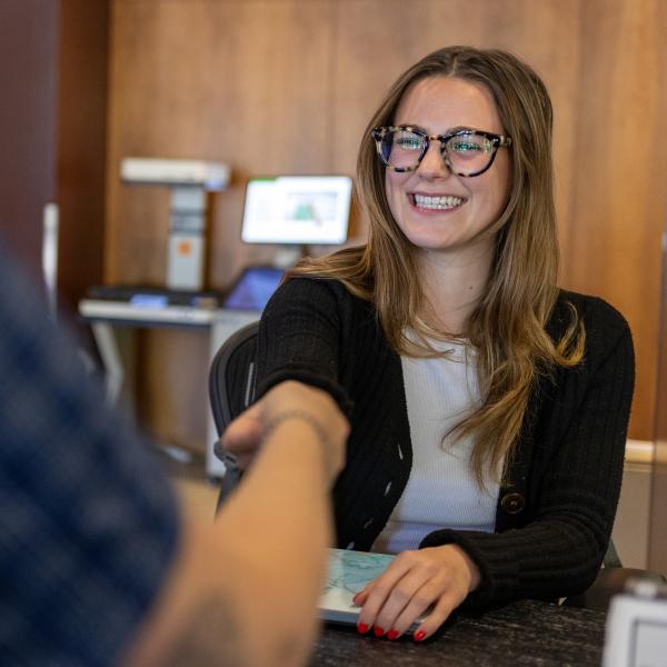 Librarian helping a student
