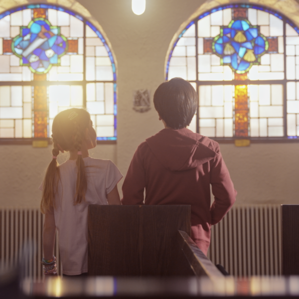 Children praying in a church