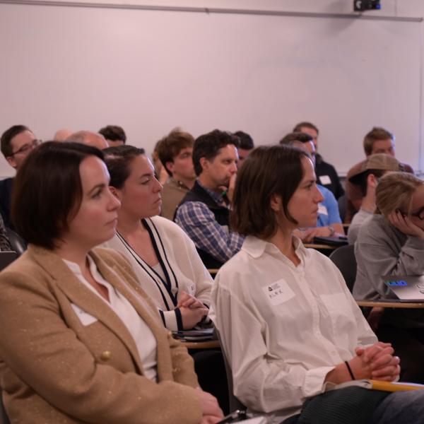 attendees listen to a talk