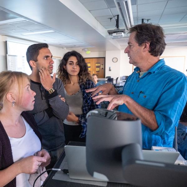 students and instructor in the lab